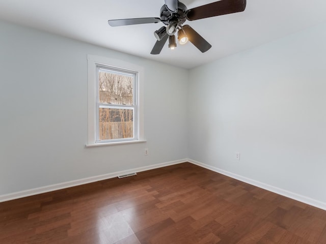 unfurnished room featuring ceiling fan and dark hardwood / wood-style floors