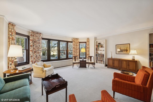 living room featuring ornamental molding, radiator, and light colored carpet