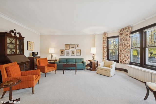 living area with ornamental molding, radiator heating unit, and light colored carpet