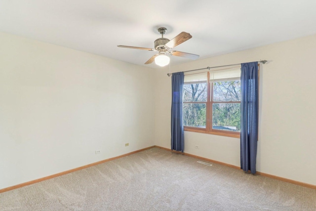 carpeted empty room with ceiling fan