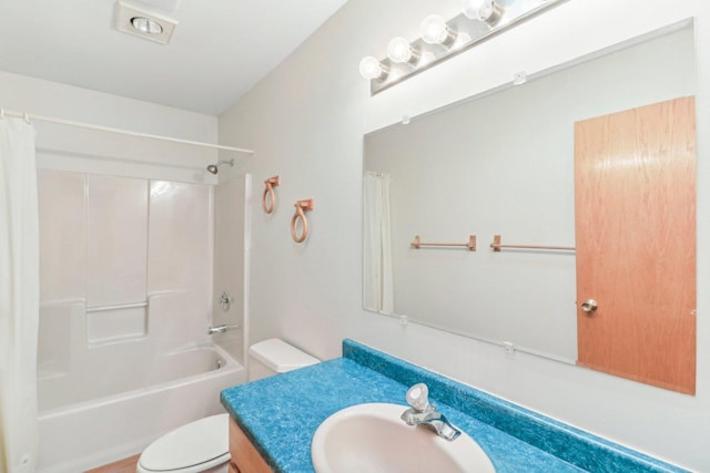 full bathroom with shower / bath combo, vanity, and toilet