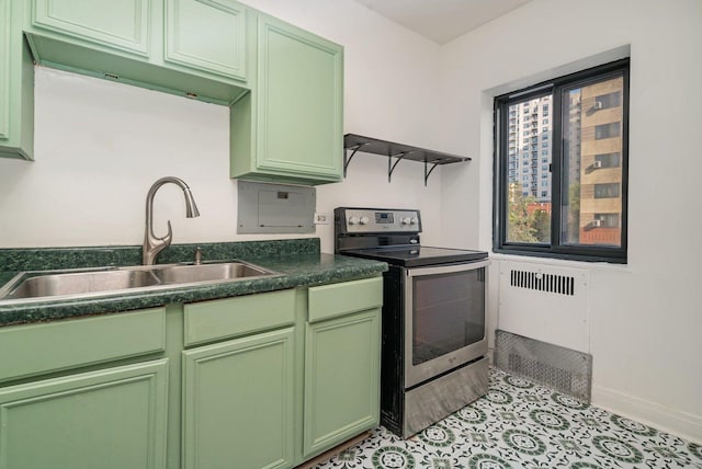 kitchen featuring sink, stainless steel range with electric cooktop, and green cabinetry