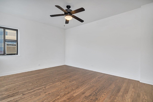 unfurnished room with dark hardwood / wood-style floors and ceiling fan