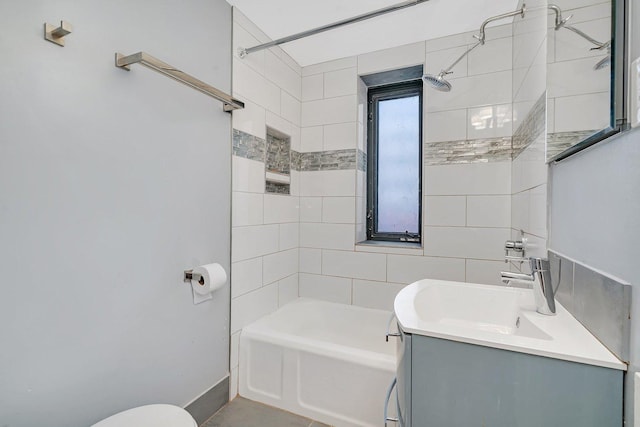 full bathroom featuring vanity, toilet, and tiled shower / bath