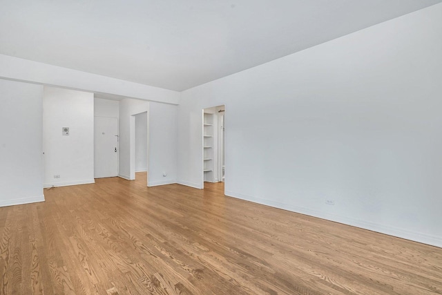 spare room featuring light hardwood / wood-style flooring