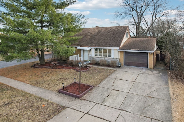 ranch-style home featuring a garage