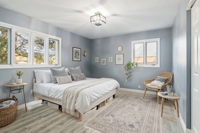 bedroom with light hardwood / wood-style floors