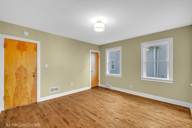 empty room with light wood-type flooring