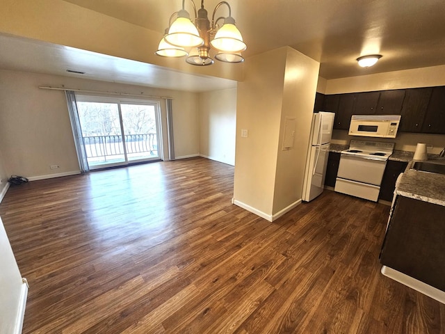 kitchen with dark wood-type flooring, dark brown cabinetry, sink, a chandelier, and white appliances