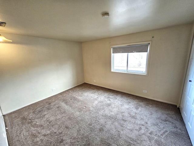 unfurnished room with carpet flooring