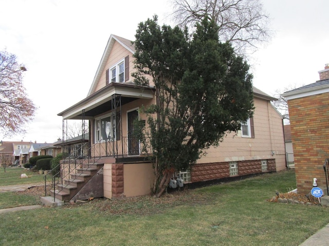 view of property exterior with a lawn