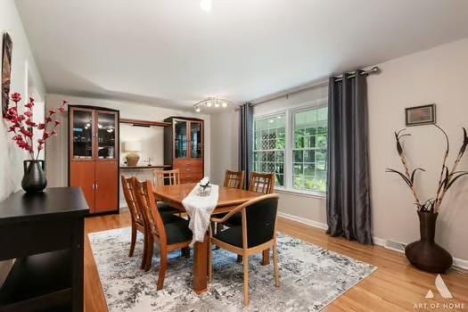 dining space featuring hardwood / wood-style floors