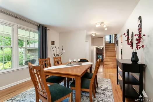 dining space featuring light wood-type flooring