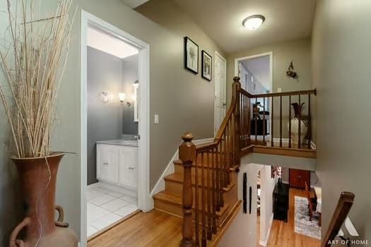 stairway featuring hardwood / wood-style floors