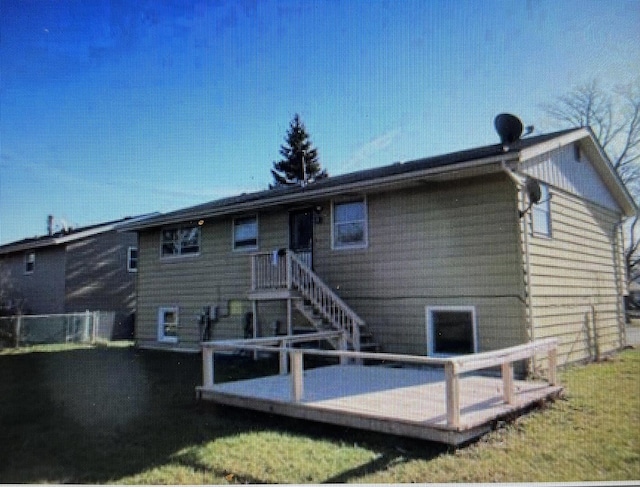 back of house featuring a deck