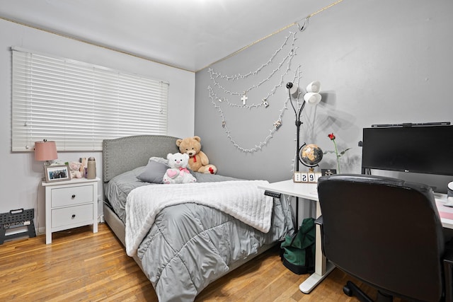 bedroom with light hardwood / wood-style floors