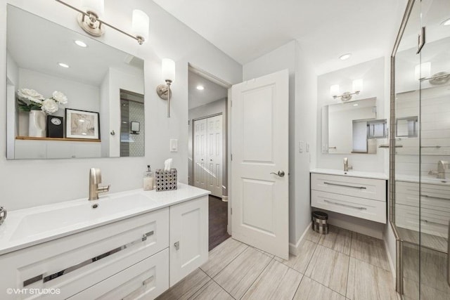 bathroom featuring vanity and a shower