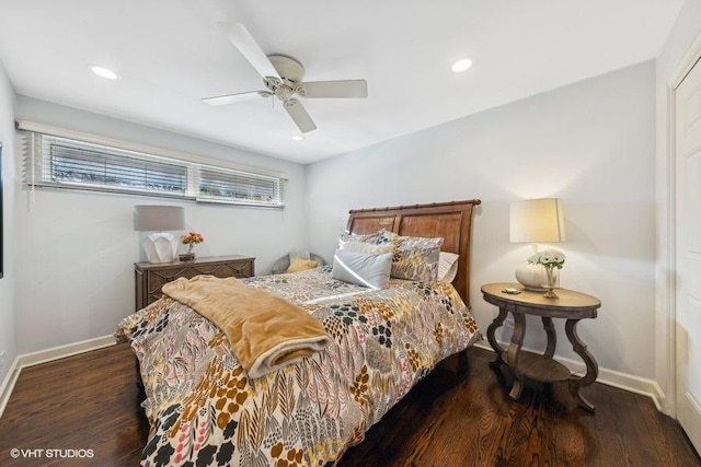 bedroom with ceiling fan and dark hardwood / wood-style floors