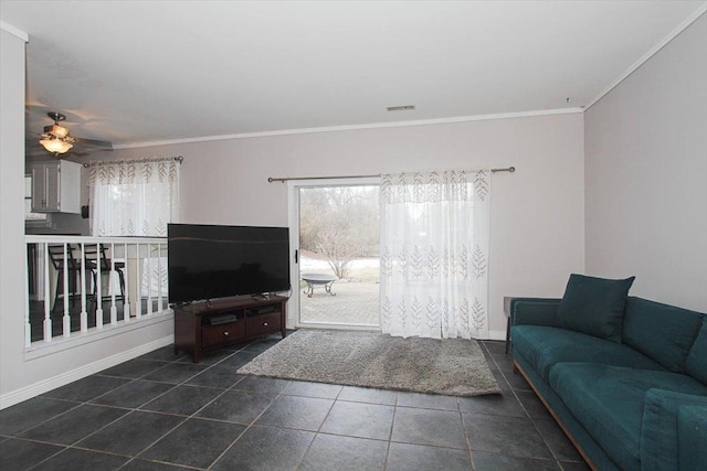 tiled living room with crown molding, plenty of natural light, and ceiling fan