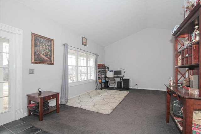 office area featuring lofted ceiling and dark carpet