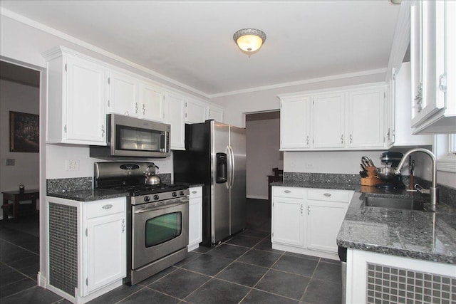 kitchen featuring appliances with stainless steel finishes, sink, and white cabinets