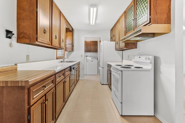 kitchen featuring light floors, light countertops, under cabinet range hood, white electric range, and brown cabinets