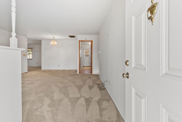 unfurnished room featuring visible vents and carpet flooring