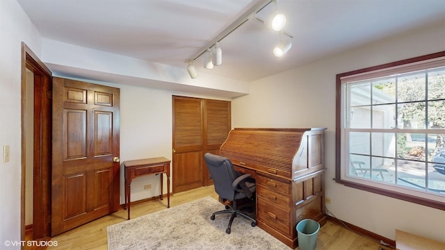 office area featuring baseboards and light wood-style floors