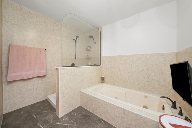 bathroom featuring tile walls and shower with separate bathtub