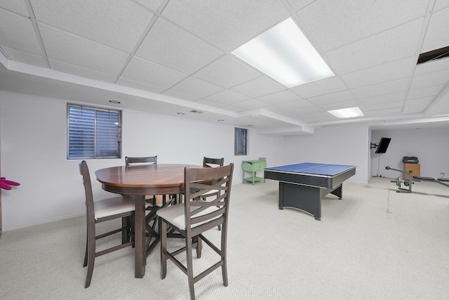 game room featuring a paneled ceiling and light colored carpet