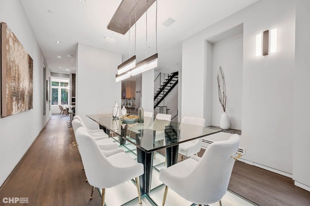 dining space with hardwood / wood-style flooring