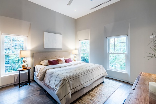 bedroom featuring ceiling fan and dark hardwood / wood-style floors