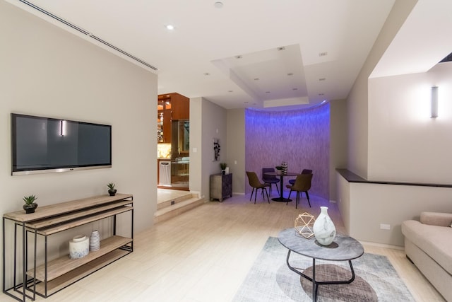 living room with a tray ceiling