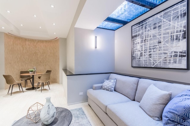 living room featuring a skylight