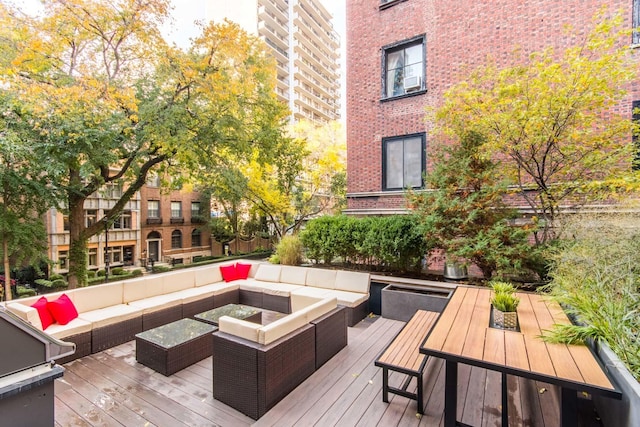 wooden terrace featuring an outdoor living space