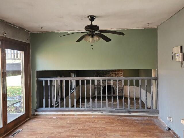 interior space with hardwood / wood-style flooring and a healthy amount of sunlight