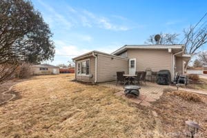 rear view of property with a yard