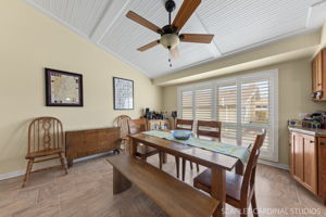 dining space with vaulted ceiling and ceiling fan