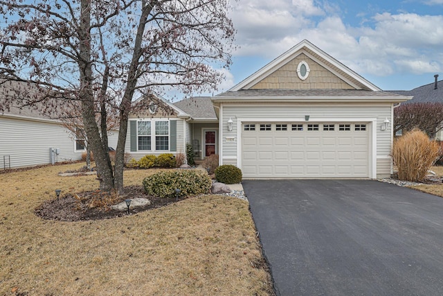 view of front facade featuring driveway and an attached garage