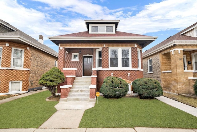 bungalow-style home featuring a front lawn