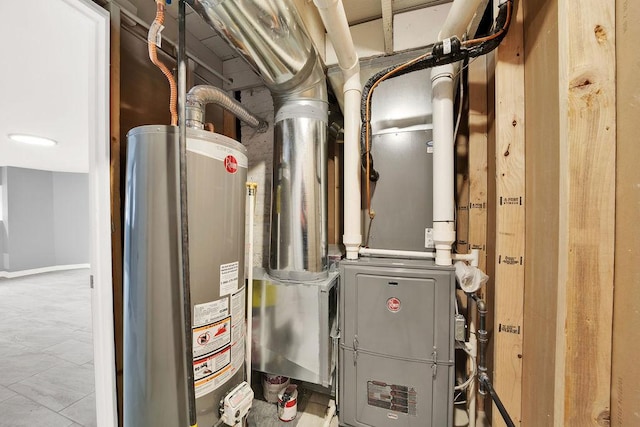 utility room featuring water heater