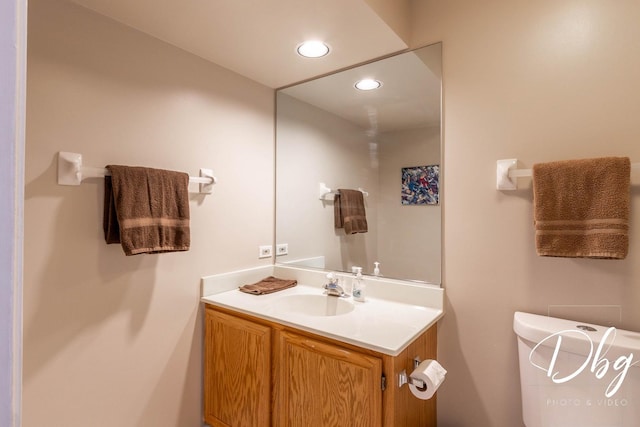 bathroom featuring vanity and recessed lighting