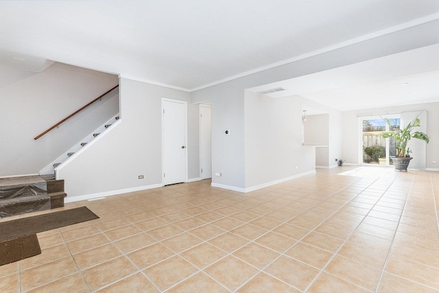 unfurnished living room with light tile patterned flooring and ornamental molding