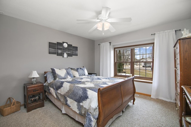 bedroom with light colored carpet and ceiling fan