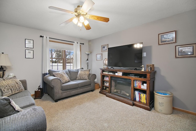 carpeted living room with ceiling fan