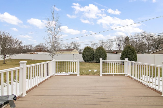 wooden terrace featuring a yard