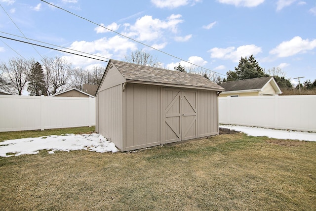 view of outbuilding with a lawn