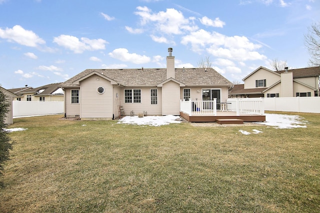 back of house featuring a wooden deck, a yard, and a patio area