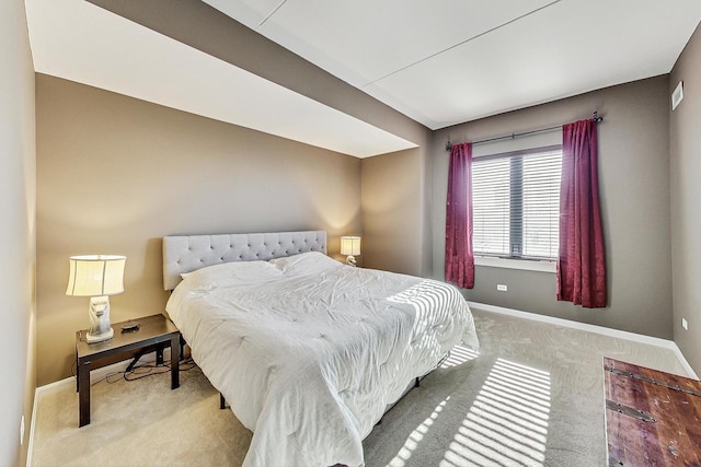 bedroom featuring light colored carpet