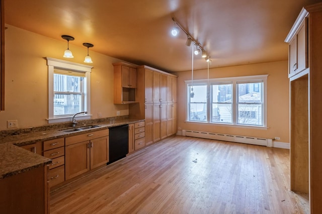 kitchen with sink, dishwasher, pendant lighting, light hardwood / wood-style floors, and a baseboard heating unit